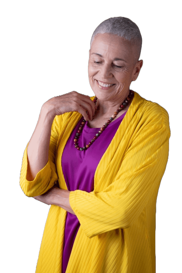 Colette wearing a purple top and yellow jacket